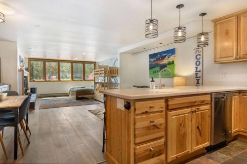 a kitchen with a large island in a room at Liftside 104 - Keystone in Keystone
