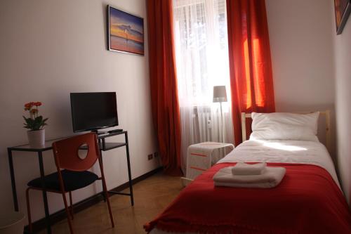 Postel nebo postele na pokoji v ubytování Lotus B&B