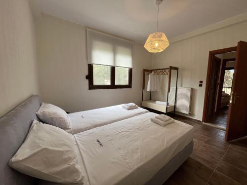 Ένα ή περισσότερα κρεβάτια σε δωμάτιο στο Captain's apartments