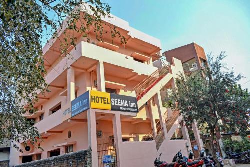 a building with a sign in front of it at SPOT ON Hotel Seema Inn in Durg