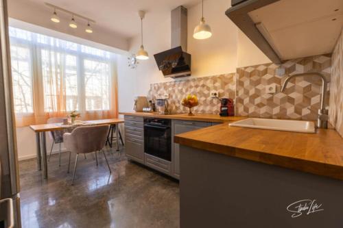 A kitchen or kitchenette at La Corte dei Bohem