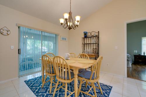 a dining room with a wooden table and chairs at Canal-Front Retreat in Crystal River! in Crystal River