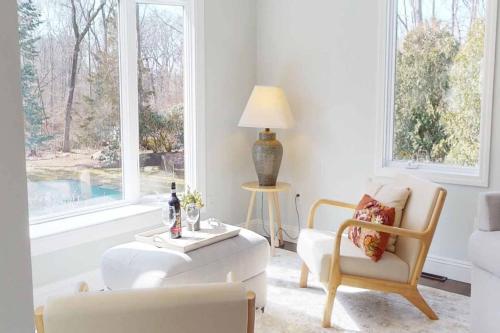 a living room with a couch and a table and two chairs at White Oaks in Branford