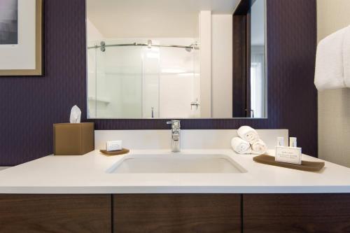 a bathroom with a sink and a mirror at Residence Inn by Marriott Los Angeles L.A. LIVE in Los Angeles