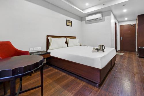 מיטה או מיטות בחדר ב-Townhouse Hotel The Grand