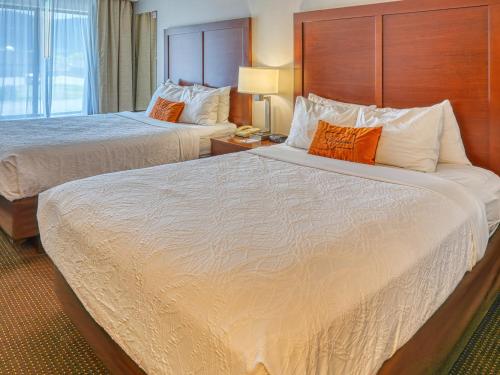 a hotel room with two beds and a window at Yellowstone River Inn & Suites in Livingston