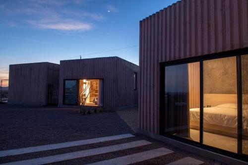 a building with a bed in the middle of it at Casa Santos in Todos Santos