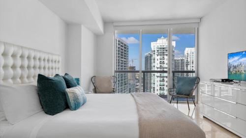 a bedroom with a large bed and a large window at Icon Brickell 1 bed Miami 32nd in Miami