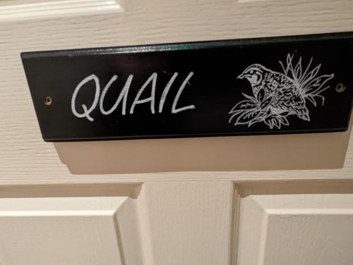 a sign for a door with a bird on it at The Manor House Inn in Shotley Bridge