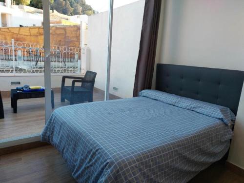 Кровать или кровати в номере Gran Apartamentos Duque Centro Ciudad Cartagena
