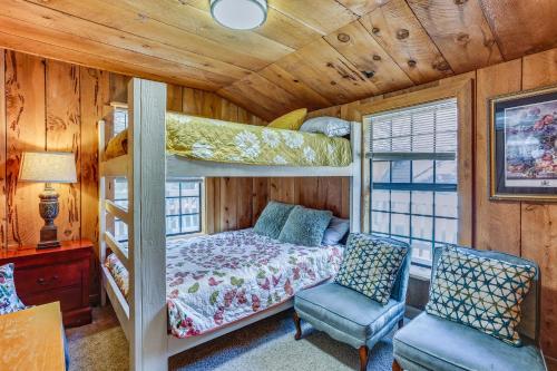 a bedroom with a bunk bed and two chairs at Idyllic Wishon Vacation Rental about 9 Mi to Bass Lake in Bass Lake Annex