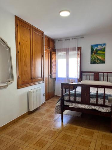 a living room with a table and a tv at LA COLMENA in Cañizares