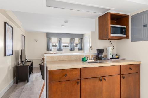 a kitchen with a sink and a counter top at The Beverly in Beverly