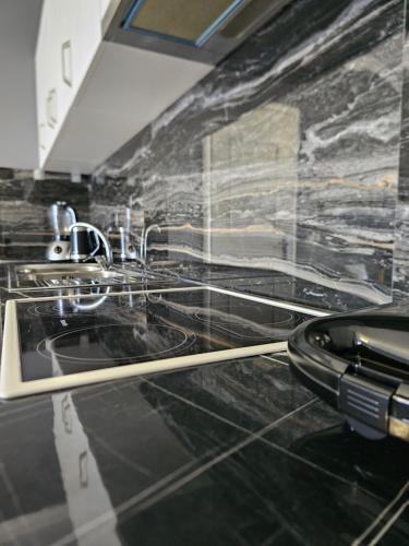 a bathroom with two sinks and a toilet at Alex's Apartment 2 in Durrës