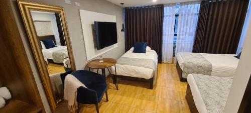 Postel nebo postele na pokoji v ubytování Hotel Corregidor by Cassana