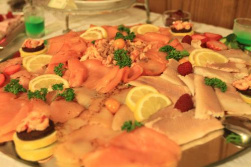 a plate of food with sushi and vegetables on a table at Waldhotel zum Bergsee Damme in Damme