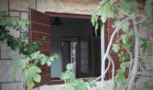 a mirror on the side of a building at Holiday Home Anja in Supetar
