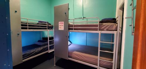 a couple of bunk beds in a room at Gaslamp Hostel in San Diego