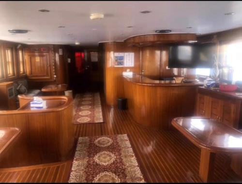 a view of a boat with wooden floors and a kitchen at Tawil 2 in Sharm El Sheikh