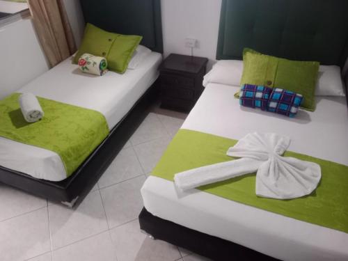 Una cama o camas en una habitación de Hotel El Deportista