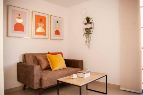 a living room with a couch and a coffee table at Cozy Apartment Rocks Guatape in Guatapé