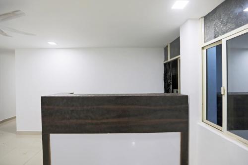 a room with a bench and a window at Townhouse South Lawn in New Delhi