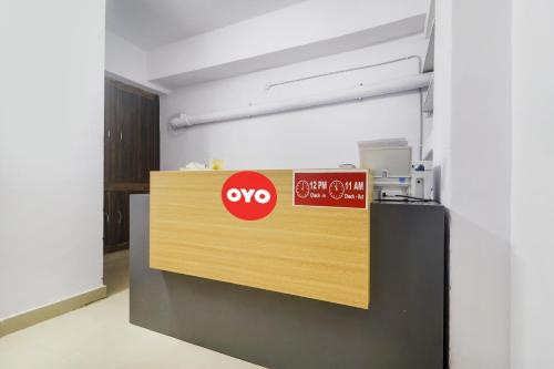 aiya sign on a counter in an office at Super OYO Broholic Hotels Near Botanical Garden in Hyderabad