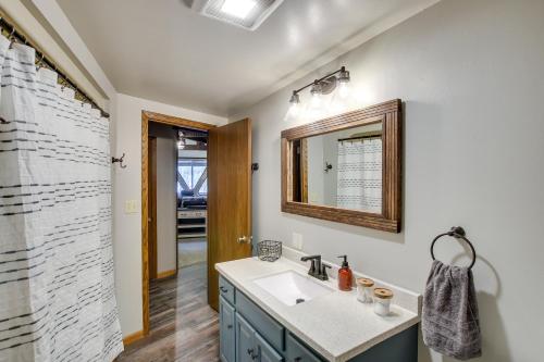a bathroom with a sink and a mirror at Wisconsin Vacation Rental 1 Mi to Road America! in Plymouth