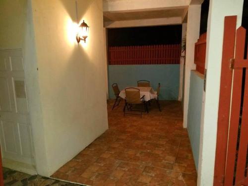 a hallway with a table and chairs in a room at Comfort Suites - Special in Choiseul