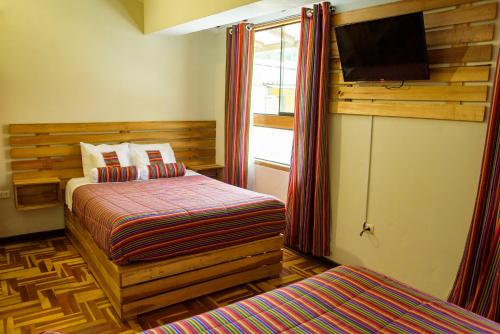 Ένα ή περισσότερα κρεβάτια σε δωμάτιο στο La Posada de Julieta Hotel