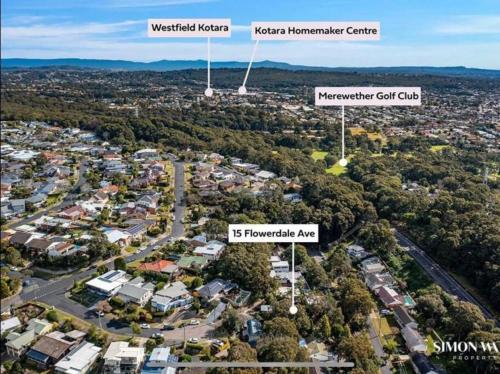 an aerial view of a suburb with wind turbines at Unique 3 Bedroom House close to Merewether Beach in Merewether