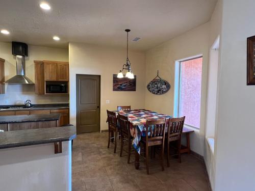 a kitchen and dining room with a table and chairs at Spacious Home in Page