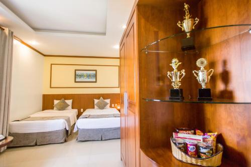 Postel nebo postele na pokoji v ubytování Lien Do Star Hotel