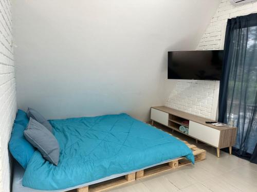 TV a/nebo společenská místnost v ubytování Qowiy Village Langat