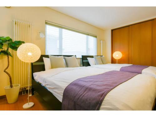 Katil atau katil-katil dalam bilik di Maison Do Ieyasu - Vacation STAY 11235
