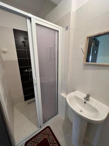 a bathroom with a shower and a sink at Appartement in Tangier