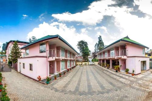 a view of the front of a building at Hotel Hills Palace in Ooty