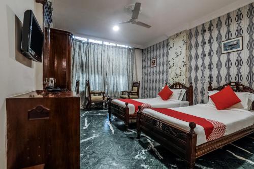 Katil atau katil-katil dalam bilik di OYO Athithi Inn Near Hyderabad Central