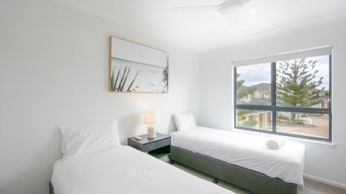 The Sands Resort at Yambaにあるベッド