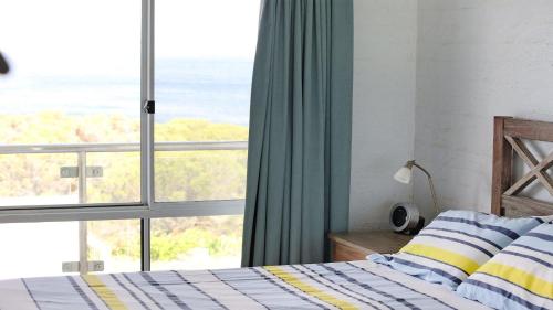 Ένα ή περισσότερα κρεβάτια σε δωμάτιο στο Unit 3 18 Surf Circle Tura Beach
