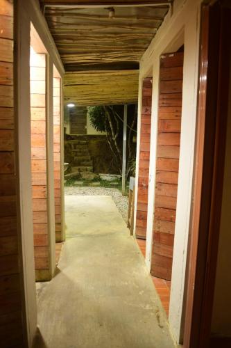 an empty hallway in a house with wooden walls at Nấp Đà Lạt in Da Lat