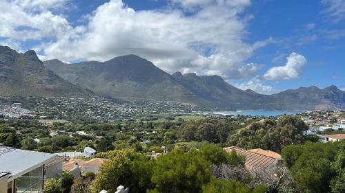 a view of a town with mountains in the background at Above & Beyond Houtbay in Hout Bay