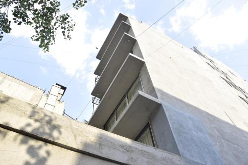 a building with a window on top of it at Sarkar Chambers in Mumbai