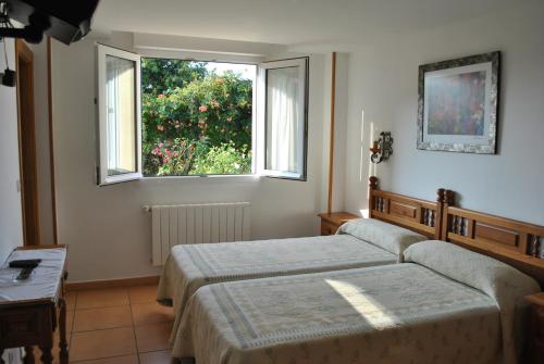 A bed or beds in a room at Fuente el Hayedo