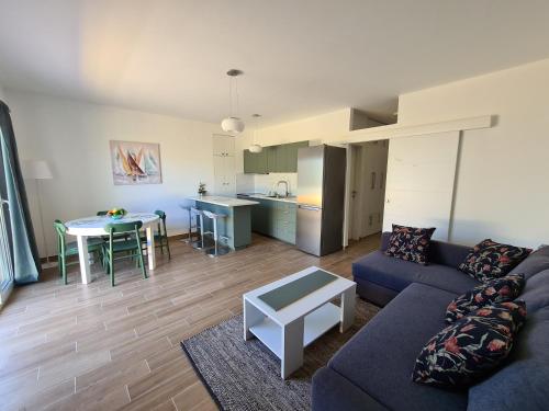 a living room with a couch and a table at Vila Elena in Prigradica