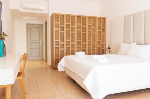 Postel nebo postele na pokoji v ubytování Astro Palace Hotel & Suites