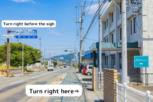 a street sign that reads turn right before the sign at SETOUCHI SUP RESORT - Ao - in Shodoshima