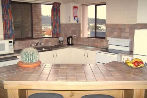 a kitchen with a sink and a counter top at Unit 3 3 Short Street Merimbula in Merimbula