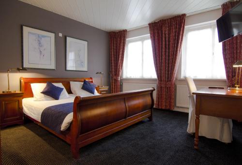 Postel nebo postele na pokoji v ubytování Hotel Boer Goossens
