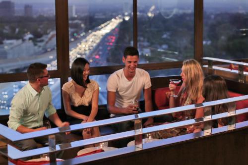 a group of people standing on the top of a building at Hotel Angeleno in Los Angeles